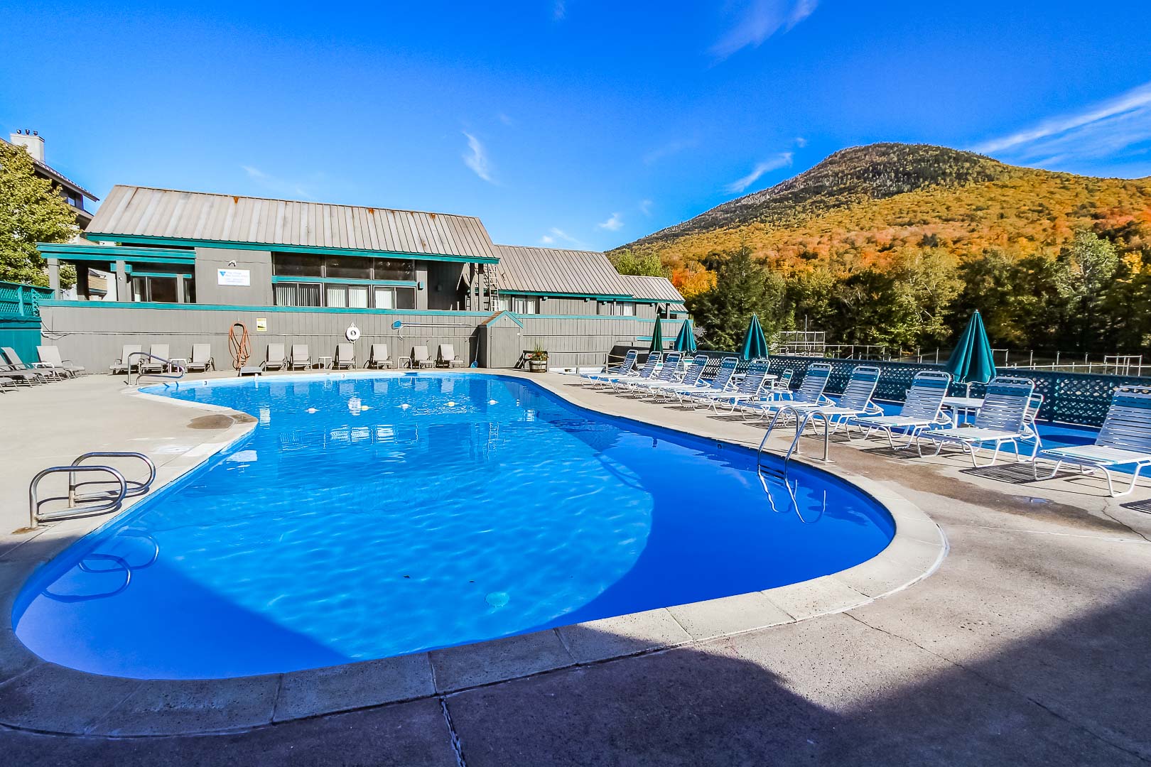 A spacious outdoor swimming pool at VRI's Village of Loon Mountain in New Hampshire.